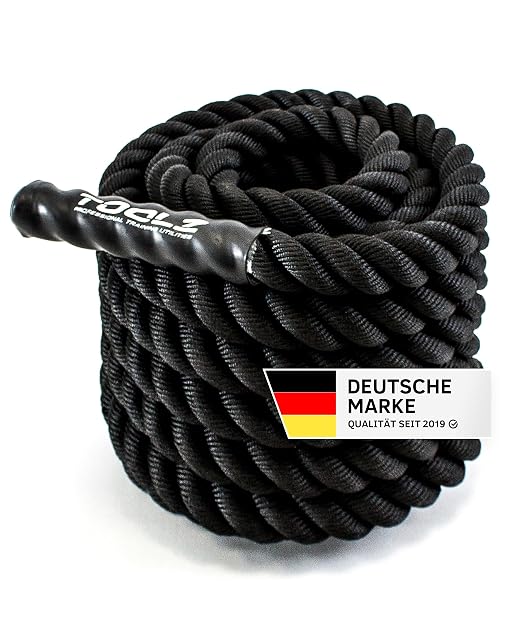 Corda ondulatoria TOOLZ avvolta, un'impugnatura rivestita in primo piano, accanto a un distintivo Deutsche Marke con la scritta Qualität seit 2019